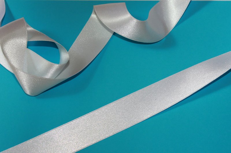 wens op wit lint schrijven met textielstift